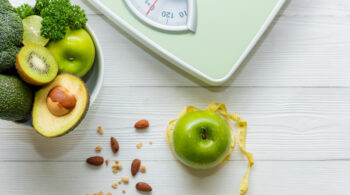 Diet and Healthy life Concept. Fresh green vegetable and Weight scale measure tap with for women diet slimming. Deit and Healthy Concept iperuricemia